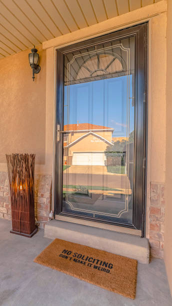 istock Vertical frame Front door and veranda of modern rendered home 1184893640