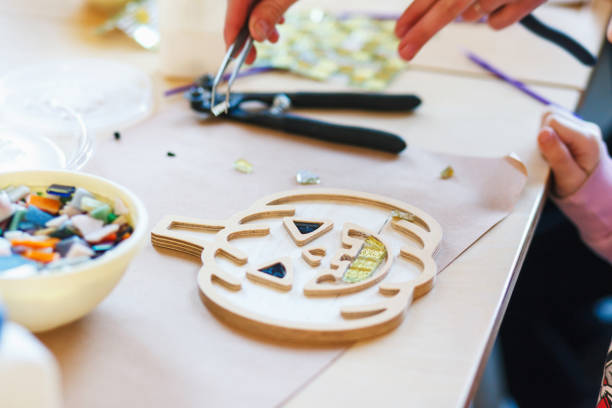 istock The process of creating a pumpkin from a ceramic mosaic 1184894329