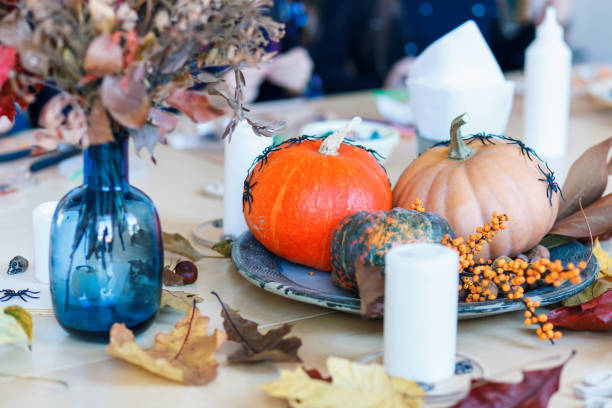istock The table is decorated with pumpkins for Halloween. 1184894474
