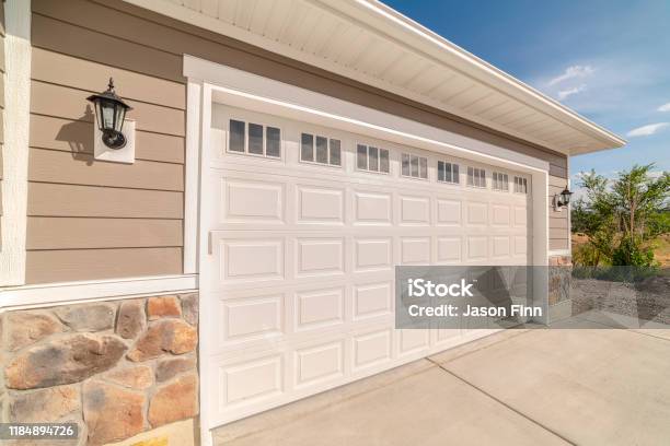 Double Garage Of Modern Home On Sunny Clear Day Stock Photo - Download Image Now - Garage, Door, House