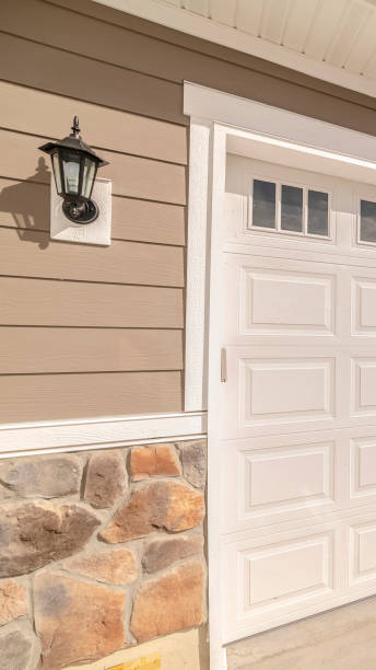 istock Vertical Double garage of modern home on sunny, clear day 1184894730