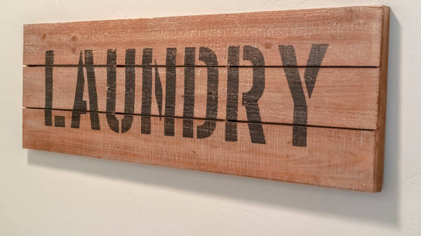istock Panorama Wooden laundry sign viewed at an oblique angle 1184894907