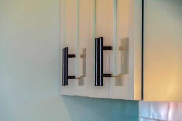 istock Close up of green kitchen cupboards and handles 1184895912