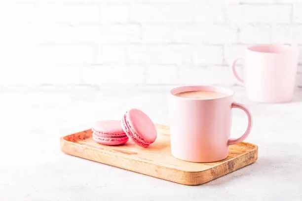 Photo of French macaroons and cup of coffee