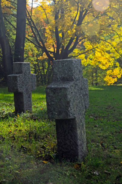 istock Stone crosses in autumn sun. 1184897188