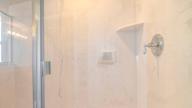 istock Panorama frame White marble bathroom shower with glass screen 1184897264