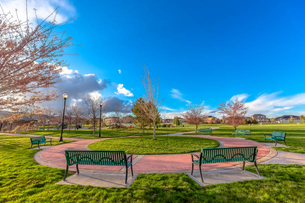istock Circular walkway in a park with empty benches 1184897477