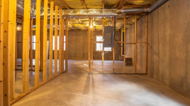 istock Panorama Building interior under construction with an electrical circuit breaker panel 1184897615