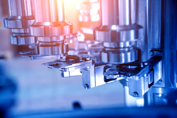 istock Automatic filling machine pours water into plastic PET bottles. Brewing production. 1184897796