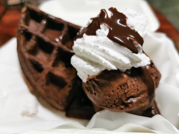 istock The chocolate waffle with chocolate ice cream and white whipped cream 1184898532