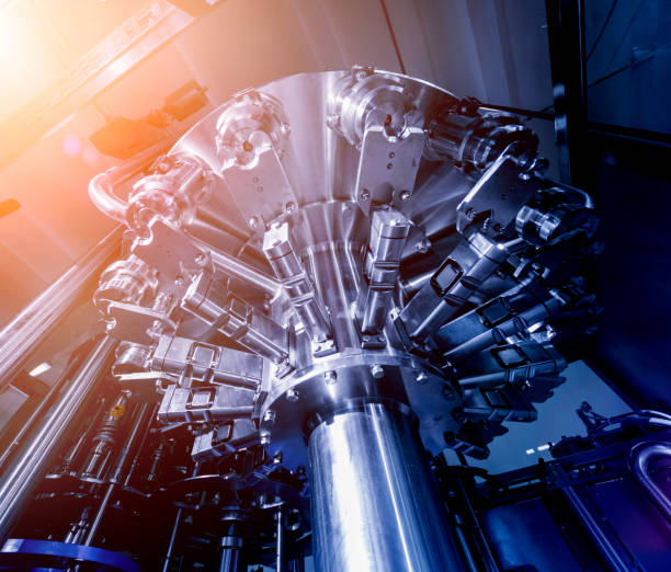 istock Automatic filling machine pours water into plastic PET bottles. Brewing production. 1184899103