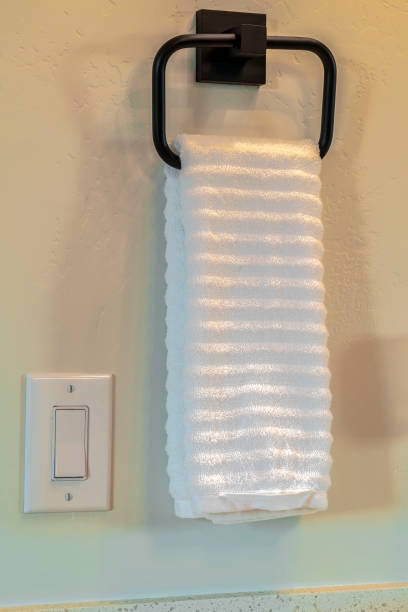 istock Clean fresh white towel hanging on a towel rail 1184899138