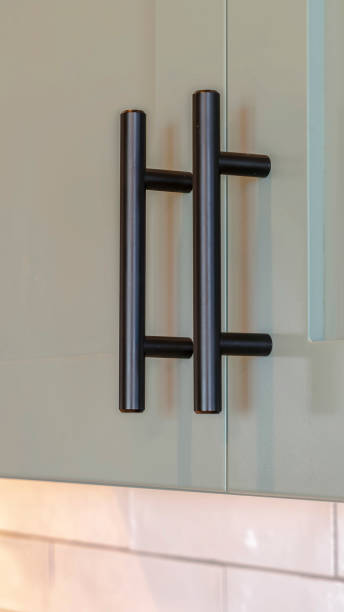 istock Vertical frame Close up of overhead kitchen cupboards and handles 1184899156