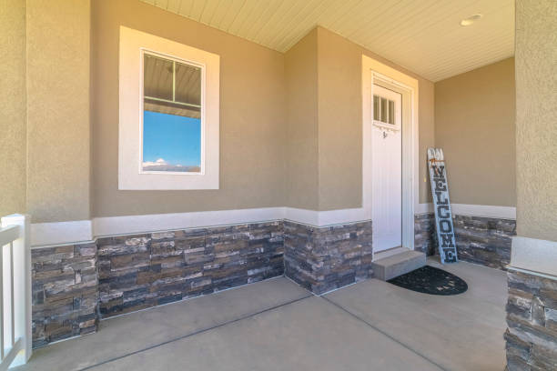 istock Front veranda of modern home with welcome sign 1184899168