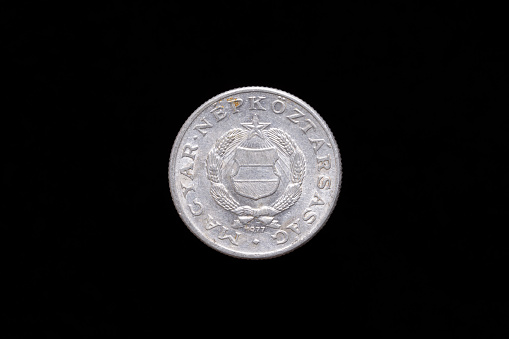 Old Hungarian People's Republic 1 Forint, 1 HUF coin from 1977, obverse showing the Emblem of the Hungarian People's Republic. Isolated on black background