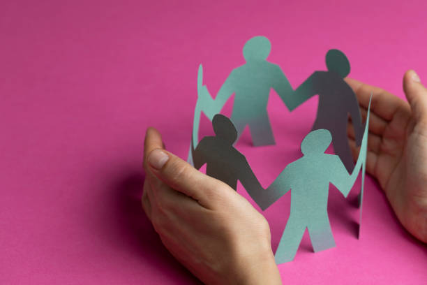 istock Hand Protecting Paper Cut Out Figure 1184902154
