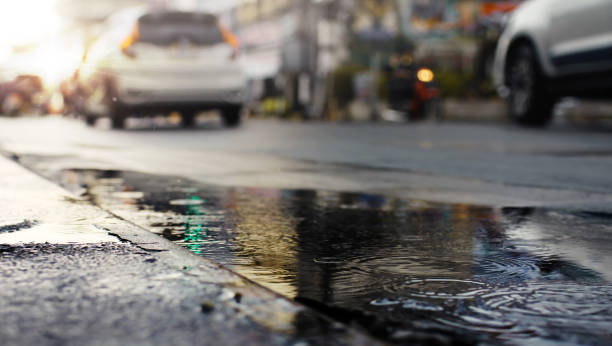 istock Morning traffic after hard rain fall at night,selective focus. 1184903258