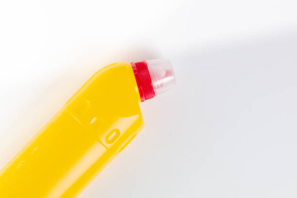 istock bottle with cleaning agent on white background. Top view 1184903539