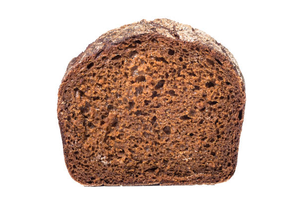 istock Slice of black rye bread, isolated on white 1184903624