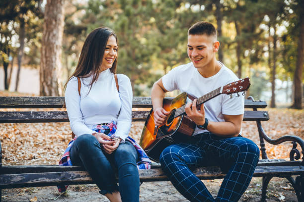 Young couple with the guitar