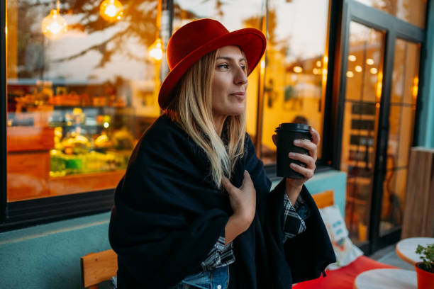 istock Woman Drinking Coffee in Reusable Cup 1184910711