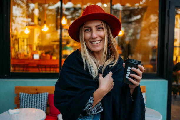 istock Woman Drinking Coffee in Reusable Cup 1184910894