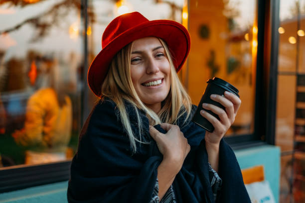 istock Woman Drinking Coffee in Reusable Cup 1184911031