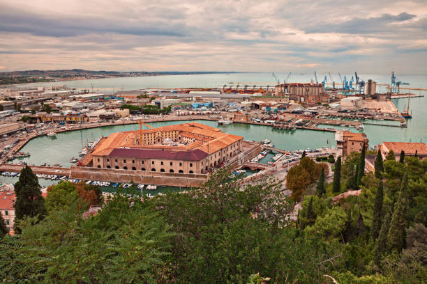 Ancona, Marche, Italy: view of the harbor and the Mole Vanvitelliana Ancona, Marche, Italy: view of the sheltered harbor for the small boats and fishing vessels with the pentagonal 18th-century building Mole Vanvitelliana marche italy photos stock pictures, royalty-free photos & images