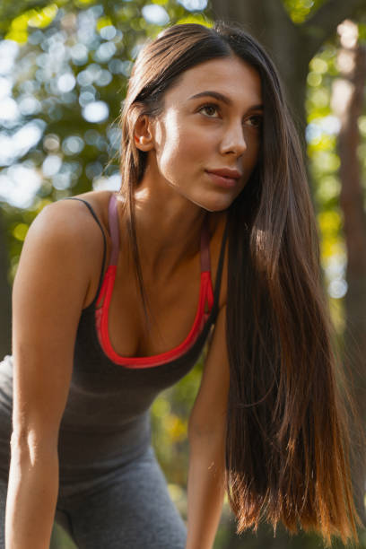 istock Pretty woman training intensively in the park 1184911246