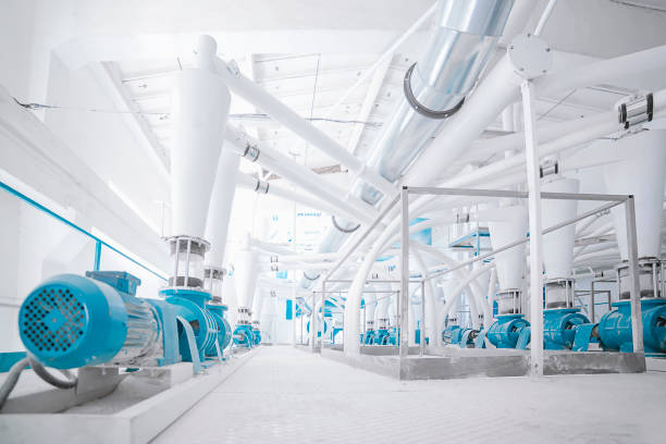 White factory White factory with a lot of big white pipes for filtration flour mill stock pictures, royalty-free photos & images