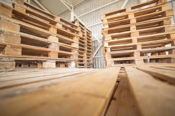 istock Empty wooden pallets in warehouse 1184912247