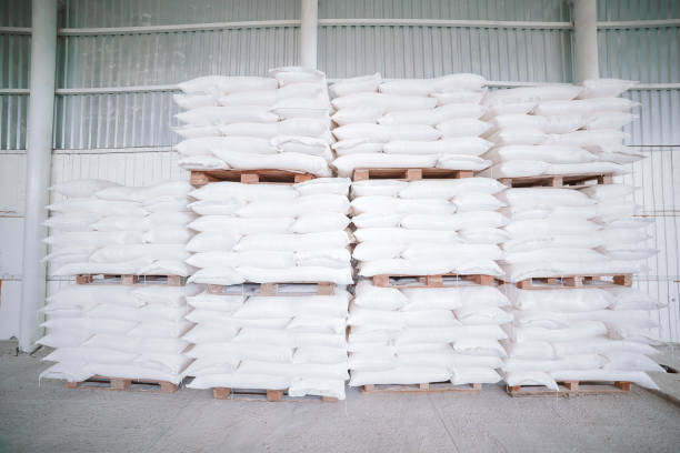 istock Warehouse with a large number of white sacks, stacked high 1184912258