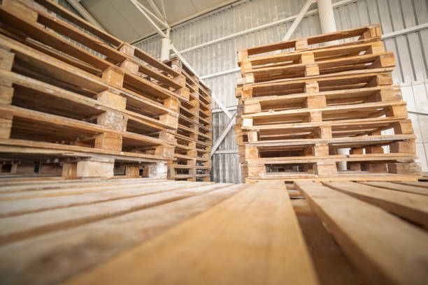 Empty wooden pallets in warehouse stock photo