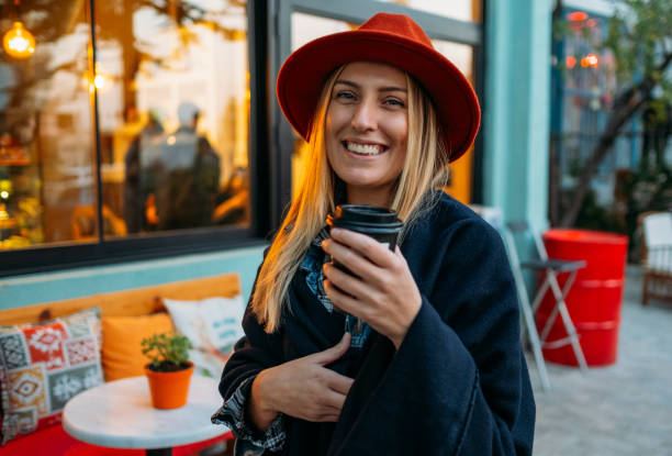 istock Woman Drinking Coffee in Reusable Cup 1184913368