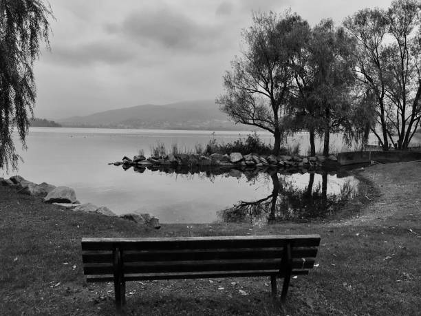 istock Lake varese’s bench and view 1184913465