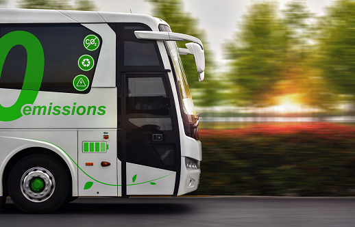 Bus with zero emissions in motion on background nature