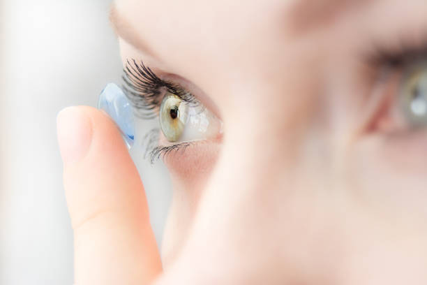 wearing soft contact lenses stock photo