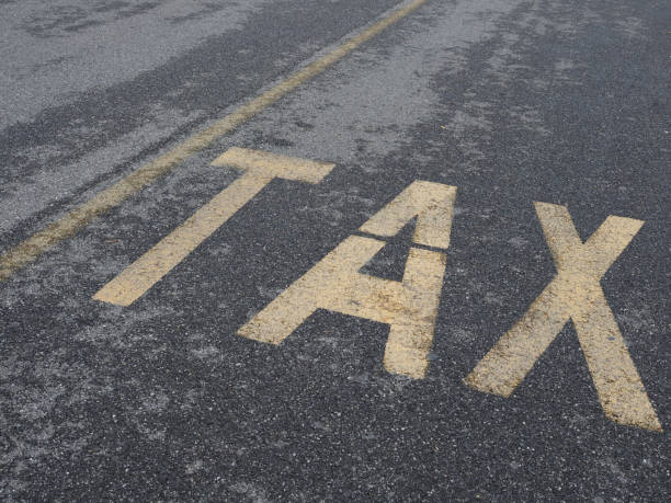 istock tax sign on tarmac 1184920095