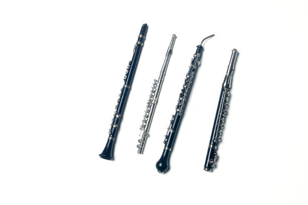 side-blown flute, clarionet, corno Inglese and piccolo flute isolated on white background flat lay