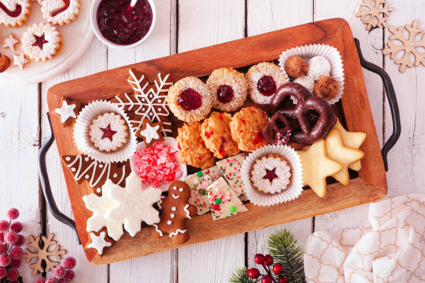 tray of christmas cookies and baking, top view table scene over white wood - cookie christmas shortbread food imagens e fotografias de stock