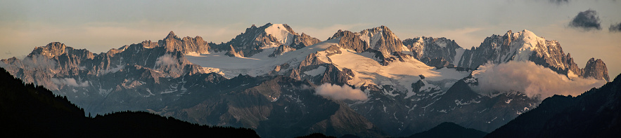 panoramic view of a mountain range at sunset