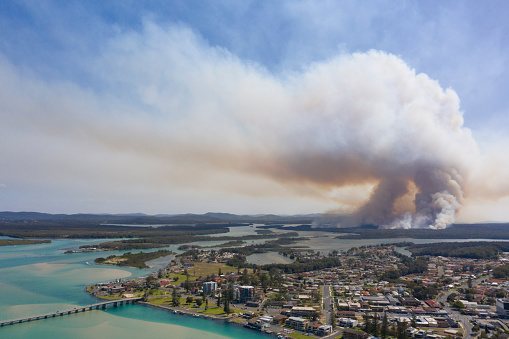 the town of Tuncurry on the new south wales north coast drone with bush fire out of control in bushland.