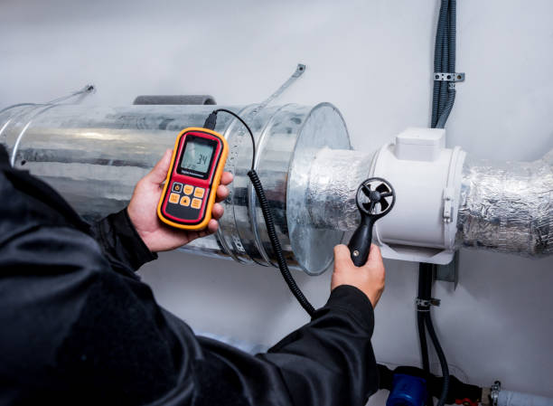 istock Technician use hand-held anemometer measuring air flowing measurement, wind speed and pressure. 1184930062
