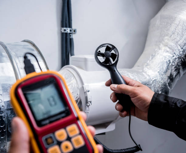 istock Technician use hand-held anemometer measuring air flowing measurement, wind speed and pressure. 1184931252