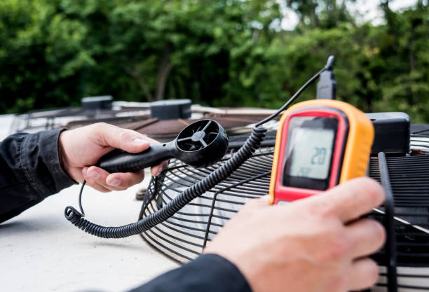 istock Technician use hand-held anemometer measuring air flowing measurement, wind speed and pressure. 1184931440