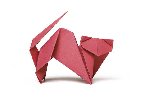 istock Small red brown origami cat on a white background 1184931442