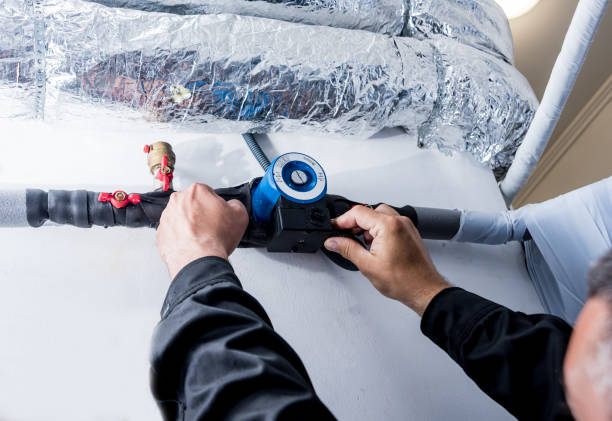 istock Ventilation cleaning. Specialist at work. Repair ventilation system (HVAC) 1184932366