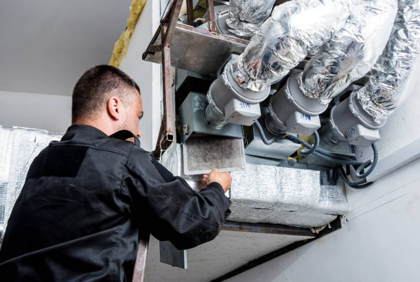 istock Ventilation cleaning. Specialist at work. Repair ventilation system (HVAC) 1184932412