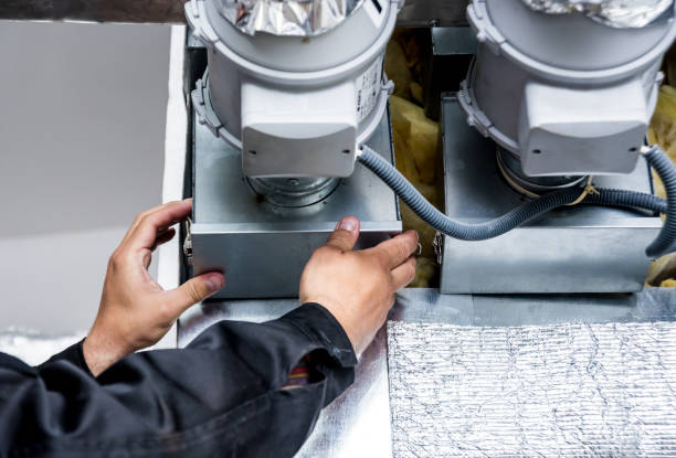 istock Ventilation cleaning. Specialist at work. Repair ventilation system (HVAC) 1184933098