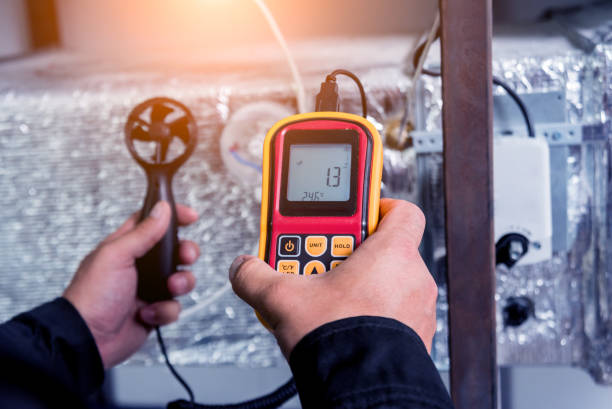 istock Technician use hand-held anemometer measuring air flowing measurement, wind speed and pressure. 1184933111